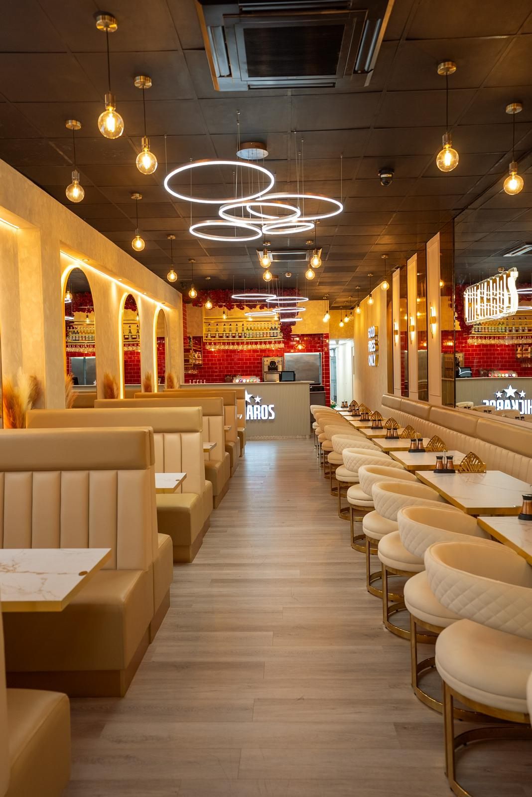 Chickaros Good Vibes Only neon and booth seating