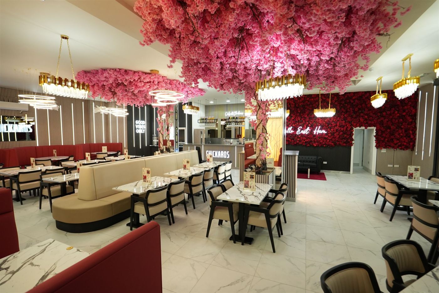 Chickaros dine-in with blossom canopy and marble tables